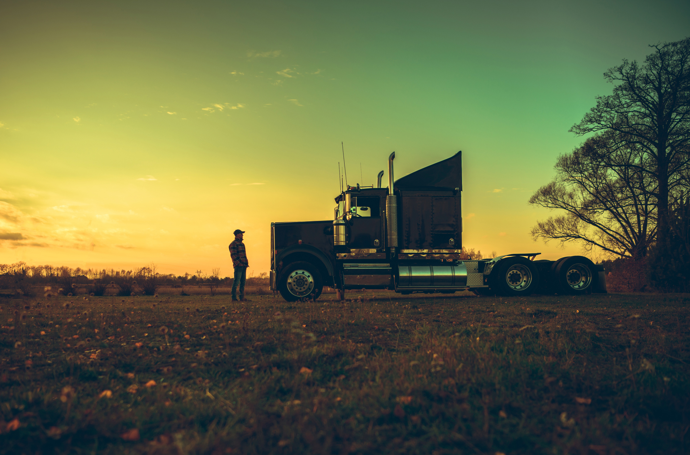 Semi Truck Driver in Front of His Vehicle